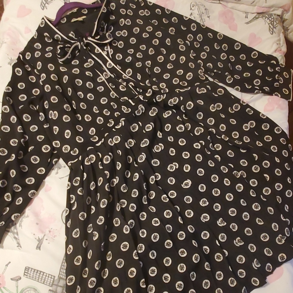 Black pleated dress with white polka dots